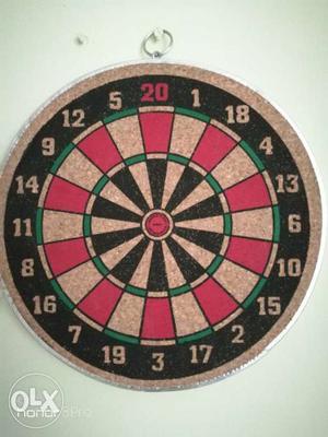 A 12" wooden Dartboard along with 4 Arrows.