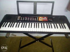 Black And White Electronic Keyboard With Stand