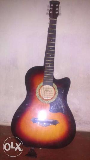 Red And Brown Acoustic Guitar