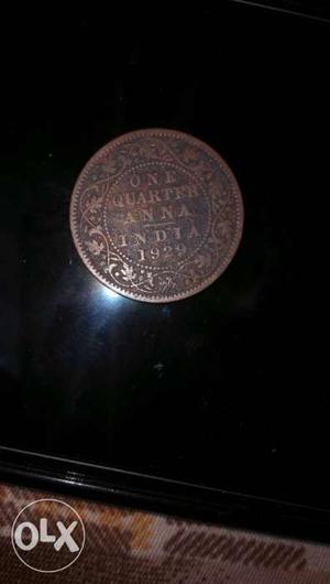 Round Bronze-colored  One Quarter Anna India Coin