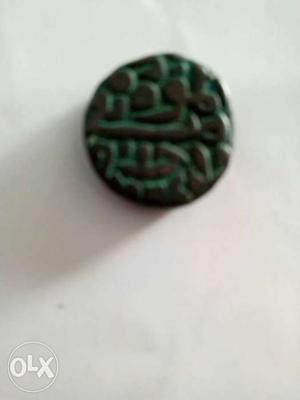 Round Green-and-brown Mughal Coin