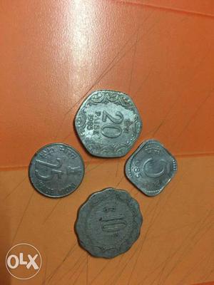 Set of four coins at ₹