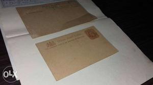 Two White And Brown Envelopes