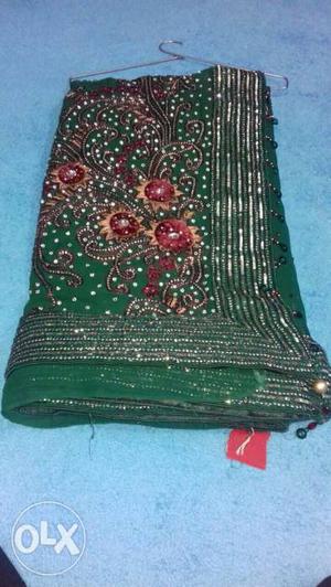 Green Textile With Flower Embroidery