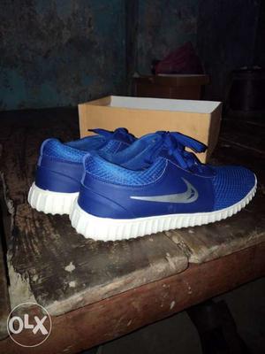 Pair Of Blue Nike Low-top Sneakers