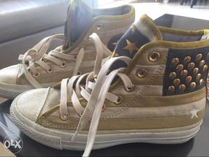 Pair Of Gold n -white Striped High-top Converse shoes