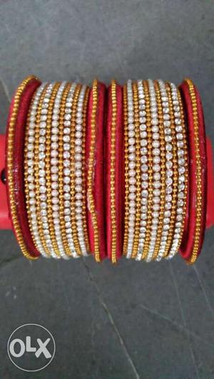 Two Red, White, And Brown Bracelets