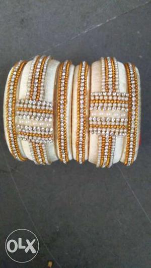 Two White-and-gold Bangle Bracelets With Beads