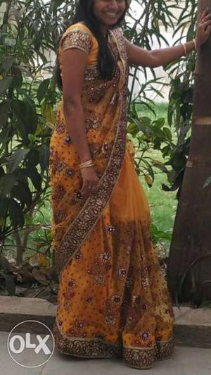 Women's golden 3 time used sari