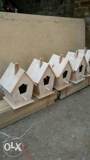Four Gray Wooden Birdhouses