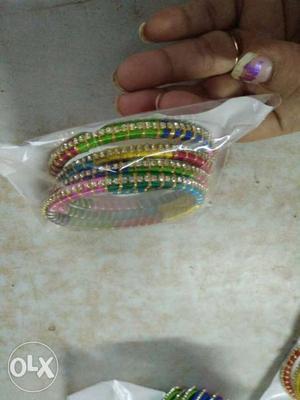 Four Multicolored Thread Bangles