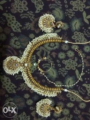 Gold-colored Bib Necklace And Pair Of Earrings With White
