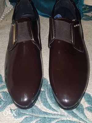 Pair Of Brown Patent Leather Slip-on Shoes