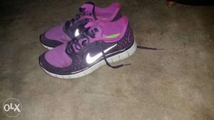 Pair Of Purple Nike Running Shoes