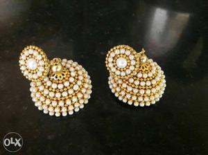 Pair Of White Pearl Gold-colored Jhumka Earrings