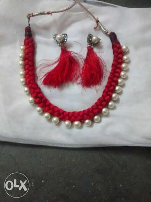 Red Necklace And Red Earrings With White Pearls