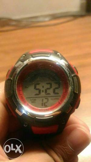 Round Red And Gray Digital Watch With Black And Red Strap