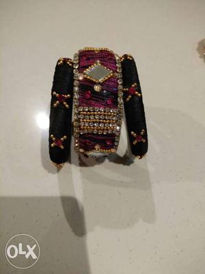 Two Black And One Maroon Silk Bangles