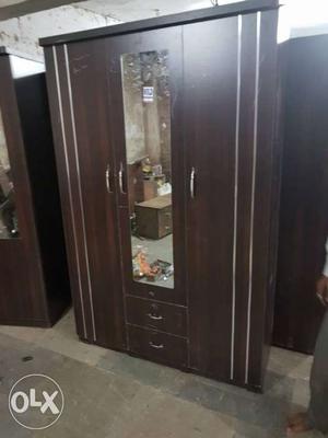 Brown Wooden Wardrobe With Mirror And Drawers