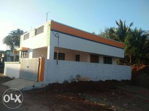 White And Orange Paint Concrete House
