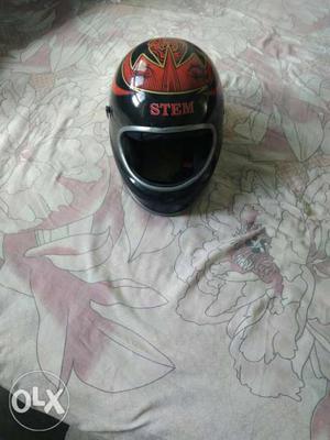 Black, Red, And Beige Full-face Motorcycle Helmet
