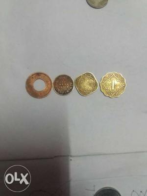 Four Round And Scalloped Gold-colored Coins