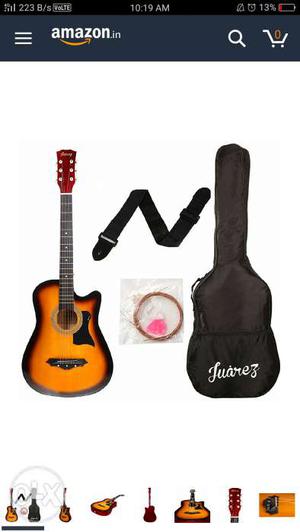 Guitar with its belt, strings, pictrum,and bag..
