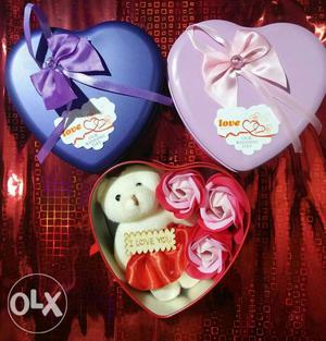 Metal heart shaped box including three roses with