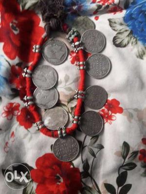 Red Charm Bracelet With Silver Coins