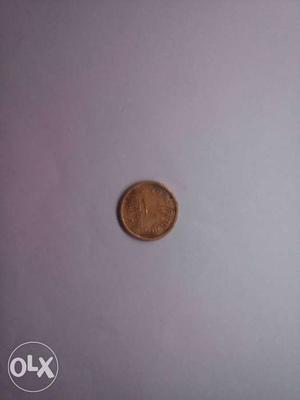 Round Gold-colored Coin