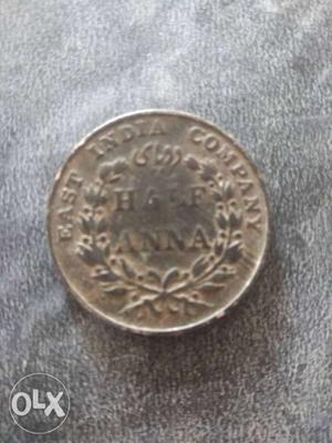 Round Silver-colored Indian Half Anna Coin