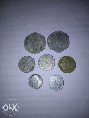 Seven Silver-colored Indian Paise Coins