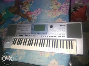 Silver Korg Electric Keyboard