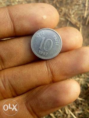  Silver-colored 10 India Paise Coin
