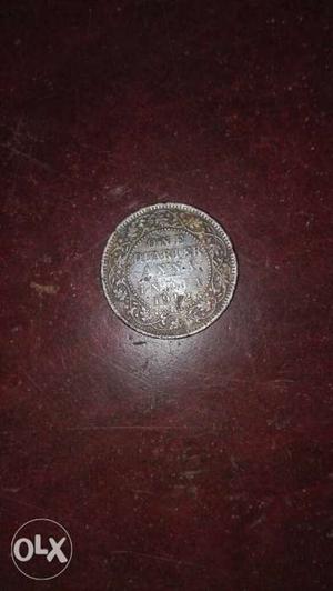 Silver-colored 1/4 Indian Anna Coin