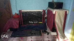 Black Flat Screen Computer Monitor, Keyboard And Mouse