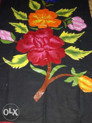 Black, Orange, And Red Floral Textile