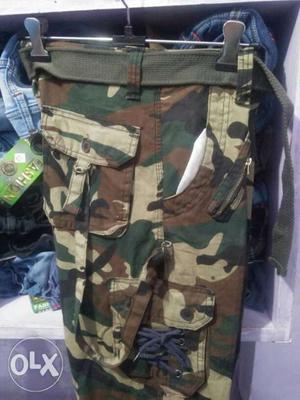 Brown, Black, And Green Camouflage Shorts New. One hand