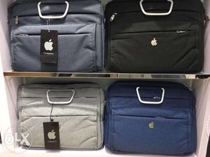 Four Black, Blue, And Gray Laptop Bags