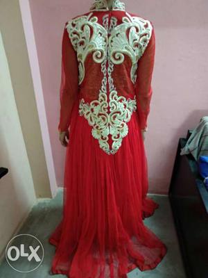 It's a beautiful heavy red colour gown.
