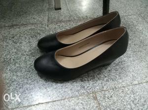 Pair Of Black Leather Wedge Shoes
