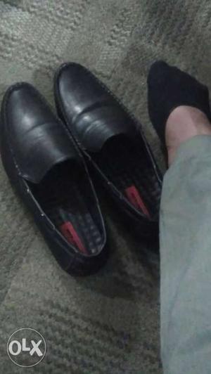 Pair Of Black Slip-on Leather Dress Shoes