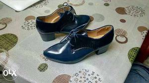 Pair Of Blue Leather Heeled Shoes