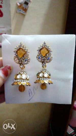 Pair Of Gemstone Encrusted Jhumka Earrings