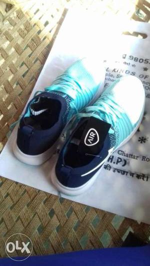Pair Of Teal-and-blue Nike Air Running Shoes