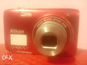 Red Nikon Coolpix Point-and-shoot Camera