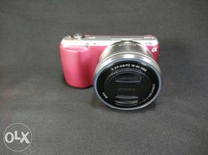 Sony nex c3 with kit lens and flash next to