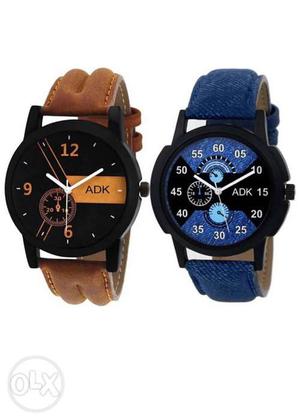 Two Round Black Chronograph Watches With Brown Leather