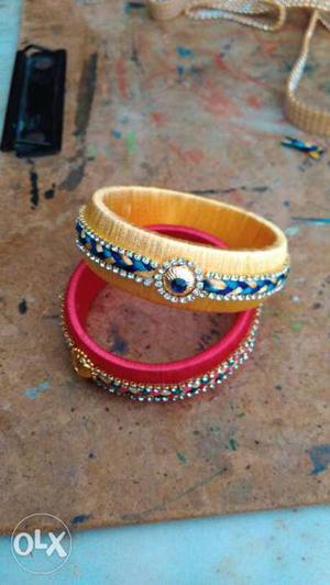 Two Yellow And Red Silk Tread Bangles