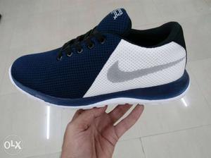 Unpaired Blue And White Nike Low-top Sneaker